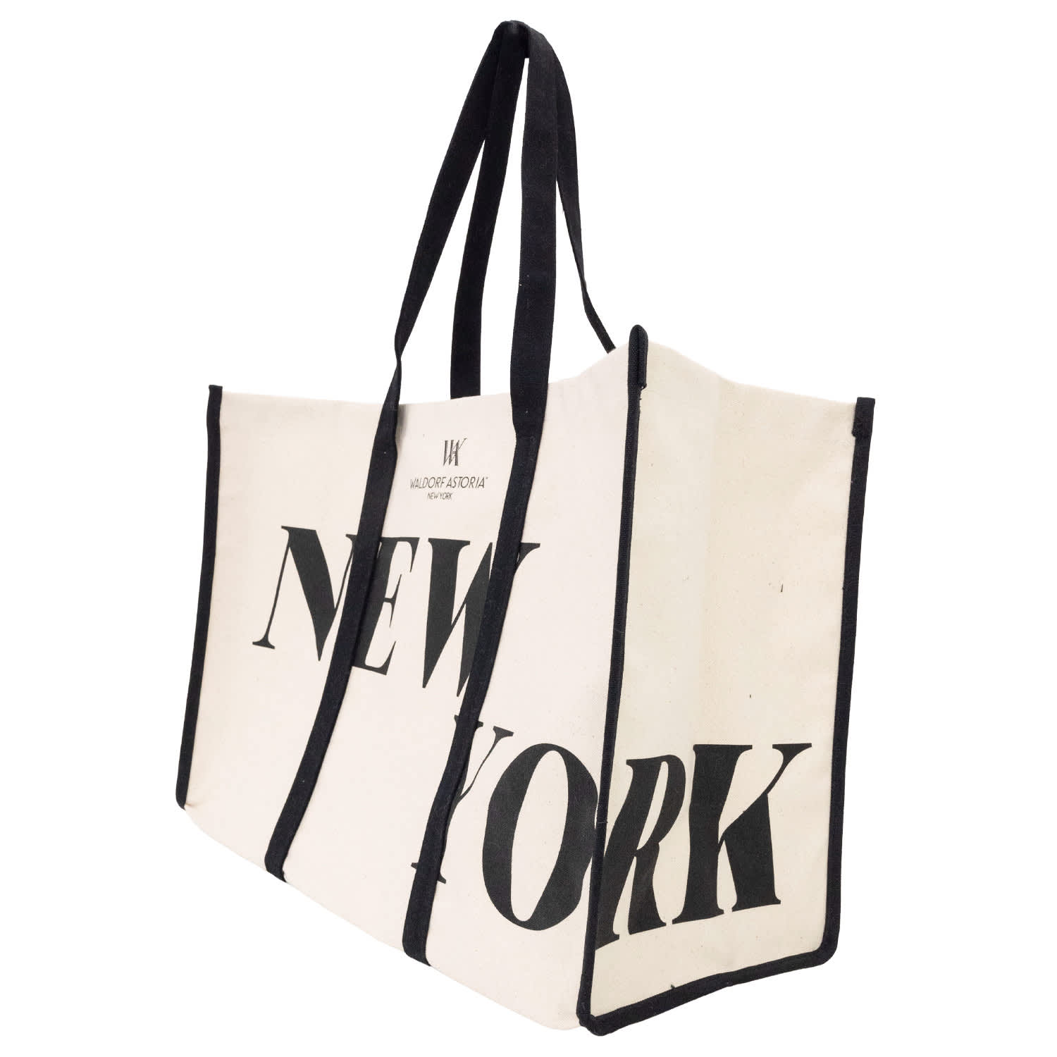 A heavy canvas tote bag in cream with black straps and a logo, featuring the text "NEW YORK" in bold letters.