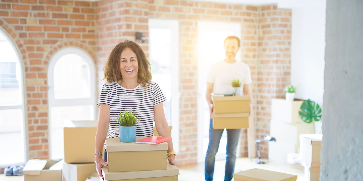 Happy couple moving for job relocation