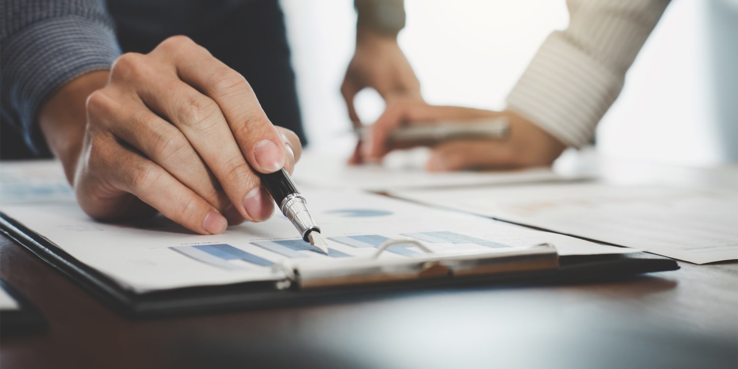 Real Estate investors reviewing plans - buyer qualification concept