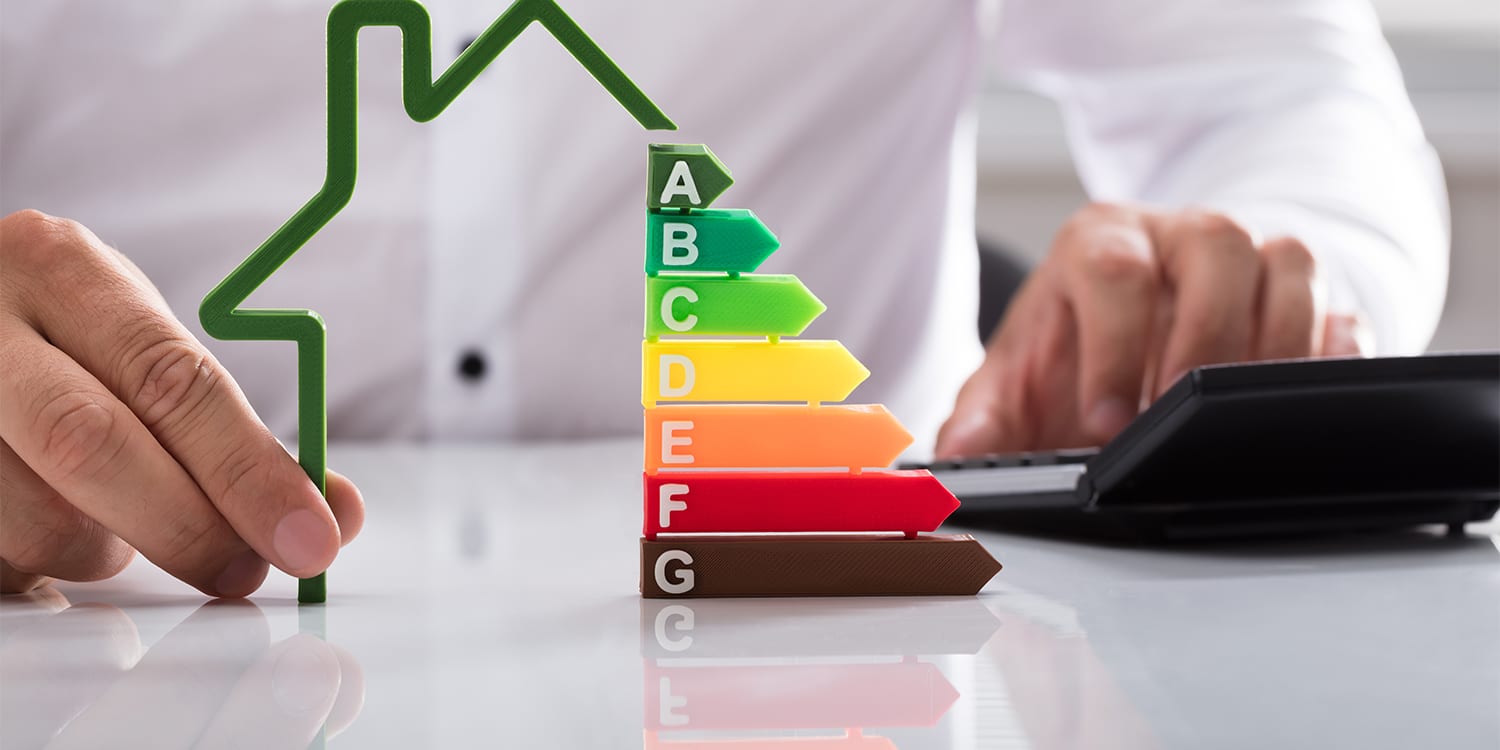 Real estate investor planning energy efficient house renovation.