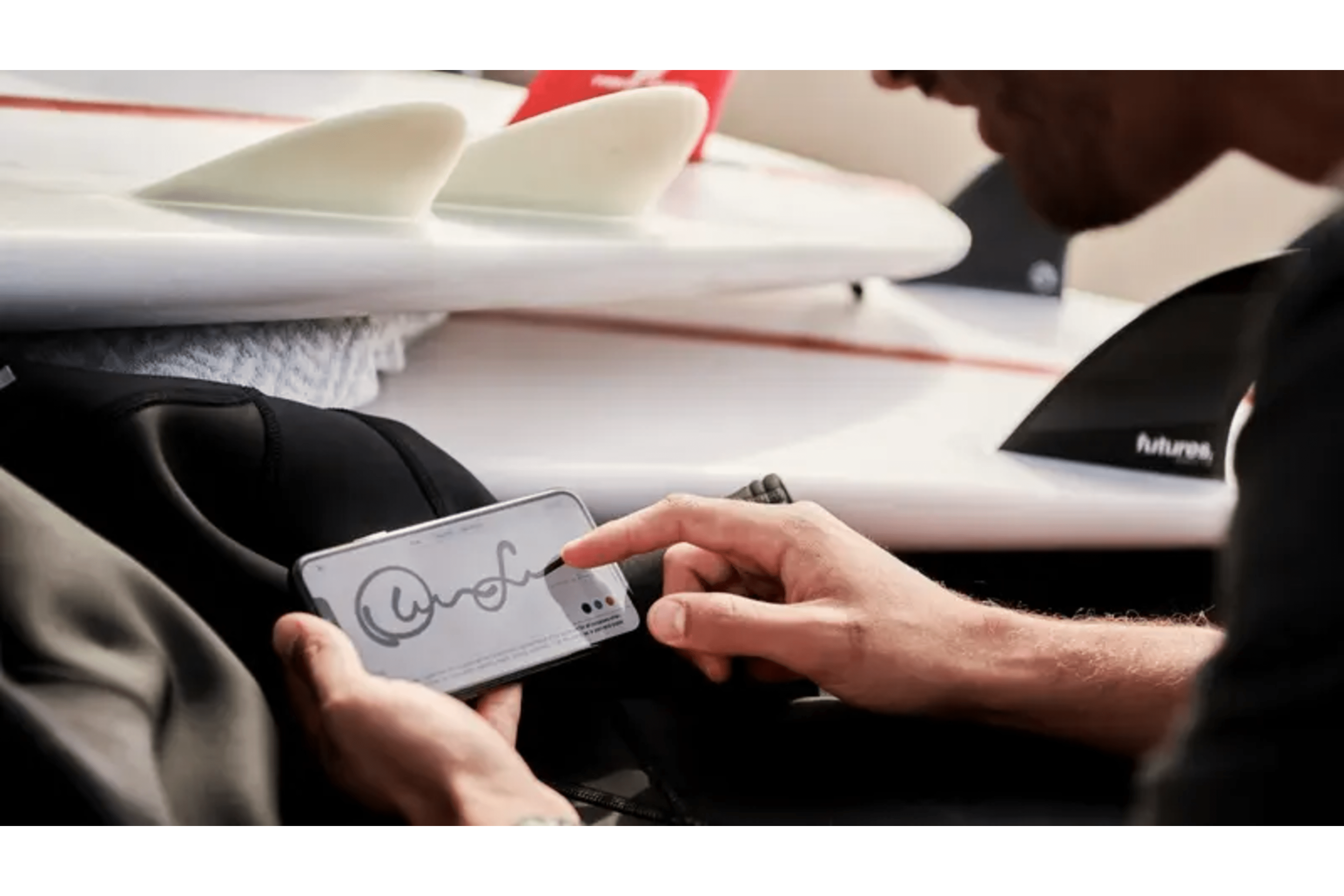 A contract being signed on a tablet