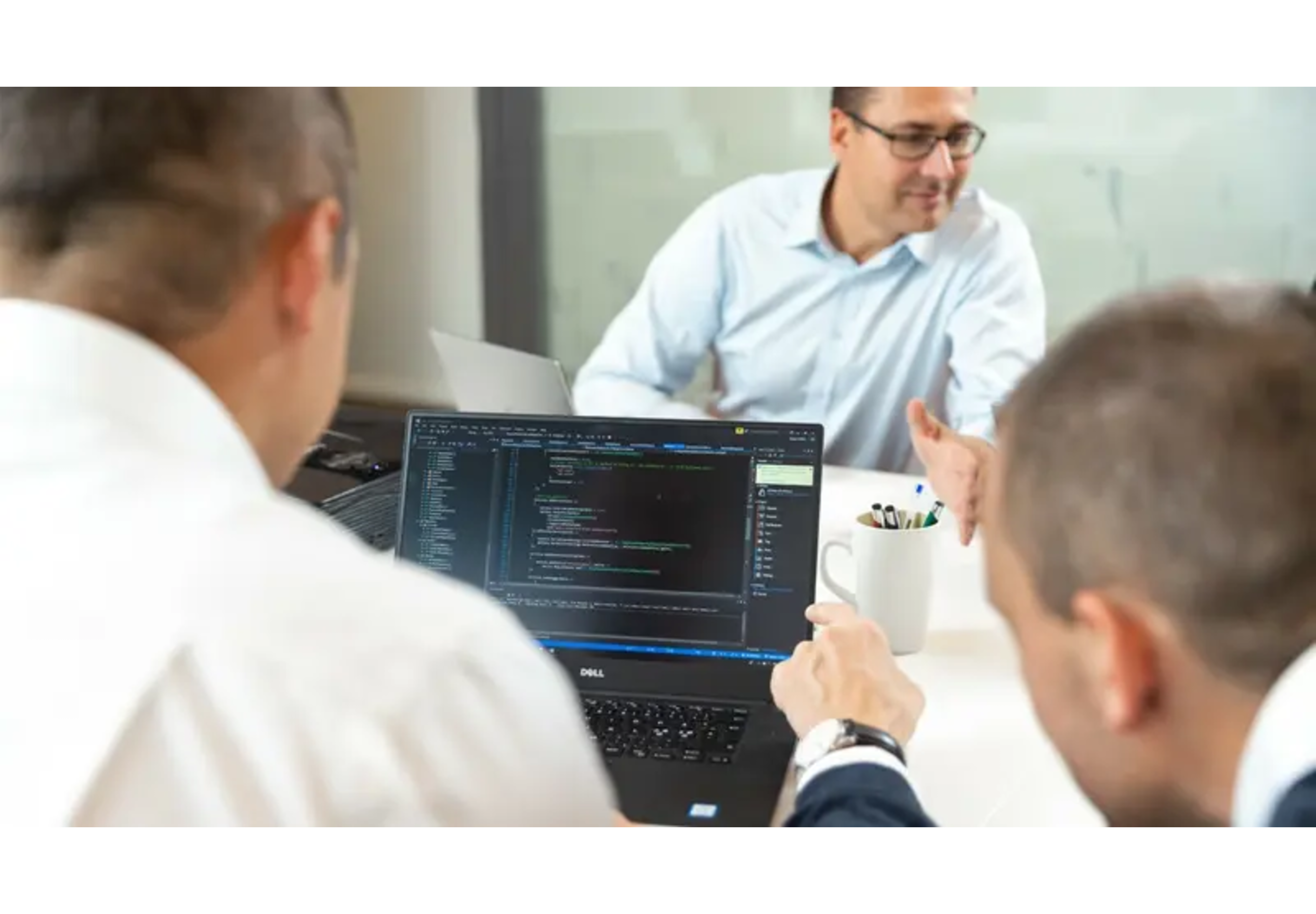 Colleagues discussing sales in a meeting