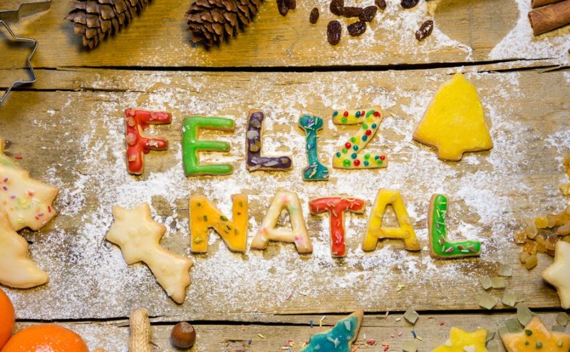 Christmas-decoration-and-biscuit-letters-on-wood-portuguese-text-feliz-natal-which-means-merry-christmas