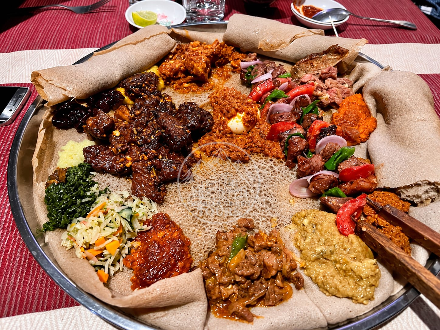 Injera served with a variety of Ethiopian dishes