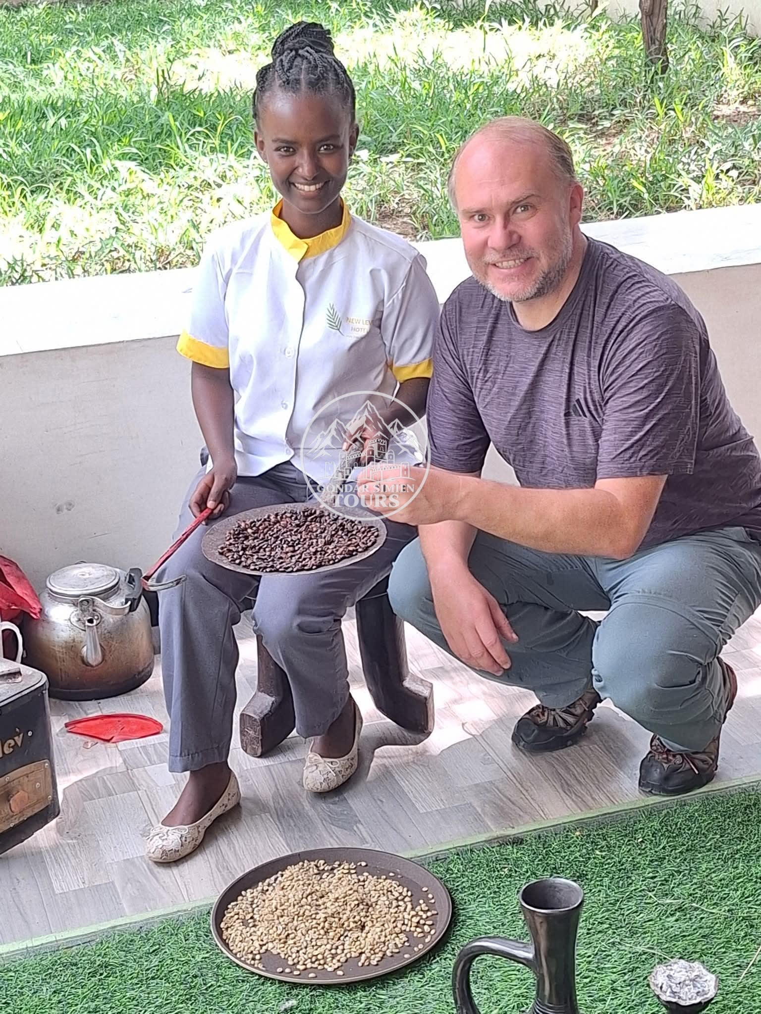 A host and visitor with coffee beans, cups and a traditional coffee pot