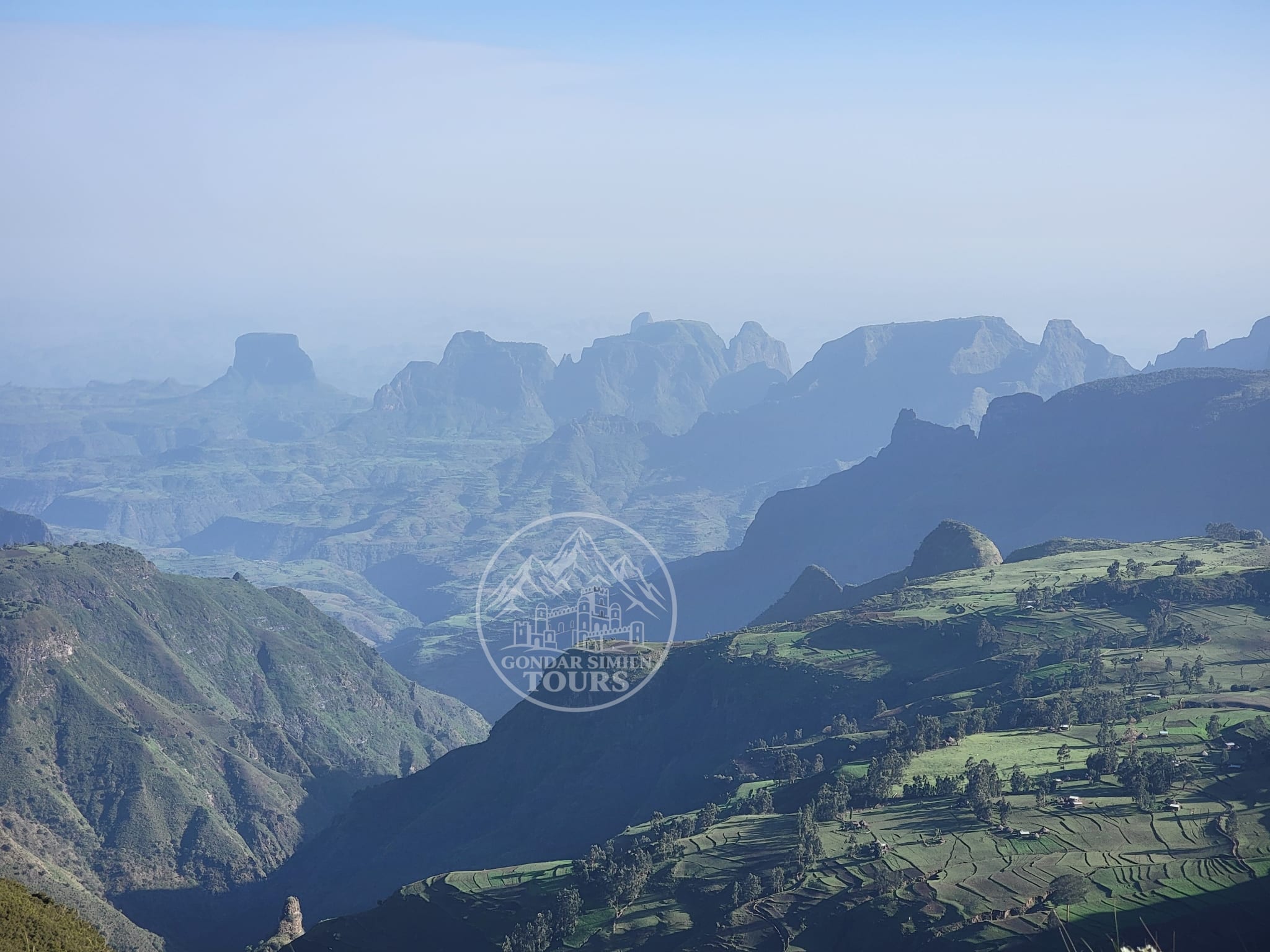 Layered cliffs and green valleys near Sankaber in the Simien Mountains