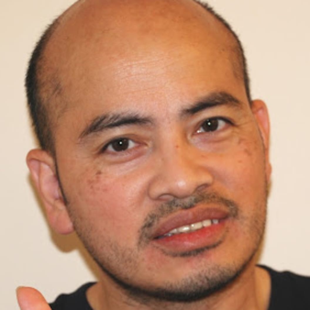 A circular avatar of Beda Hilarion Mejorada