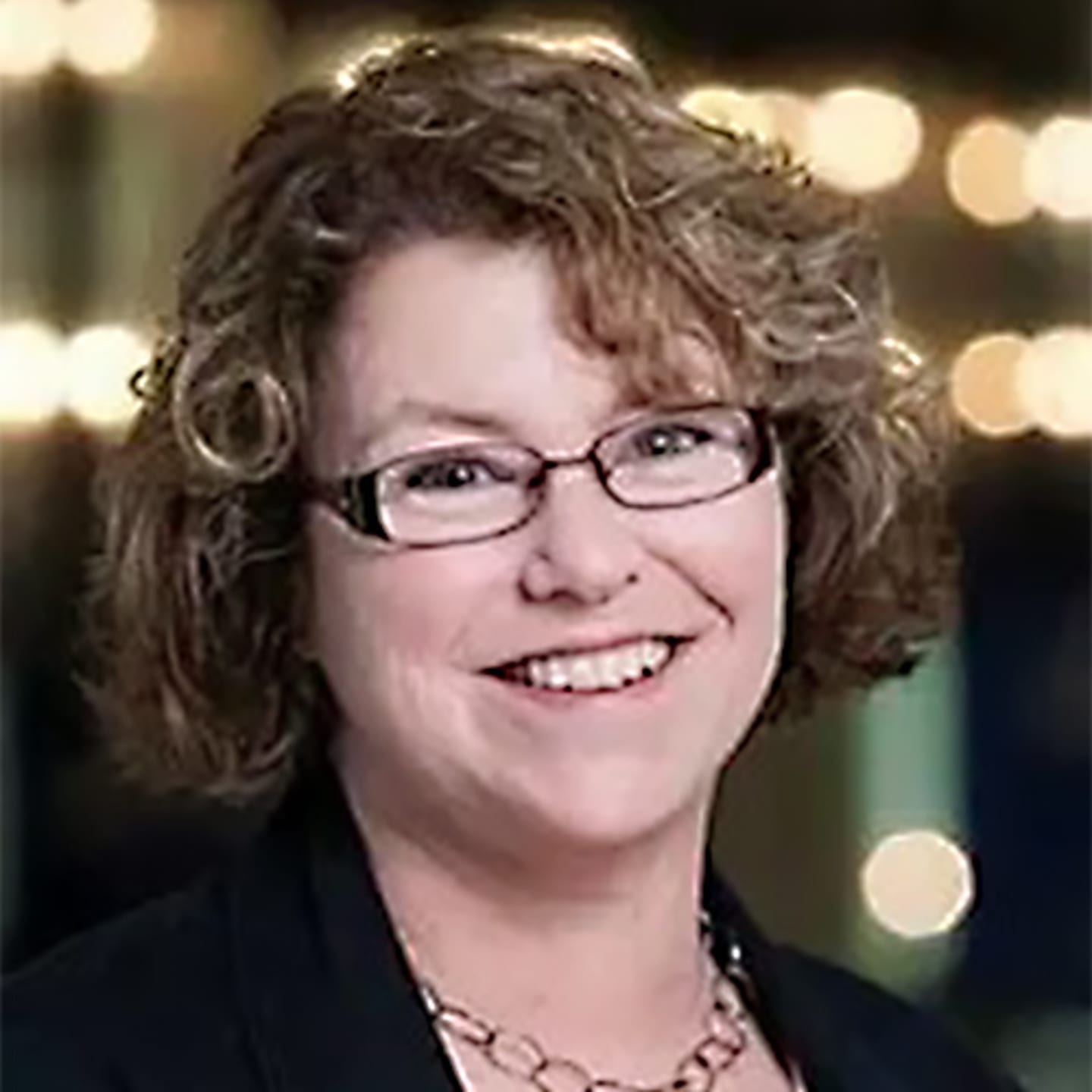 A circular avatar of Ann Garland