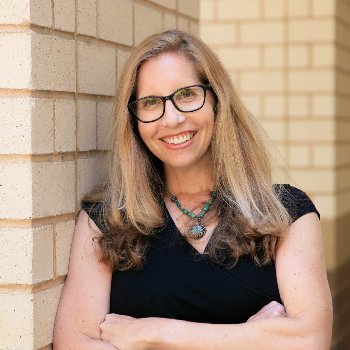A circular avatar of Dr. Jessica Borelli
