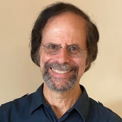 A circular avatar of Elliot Cohen