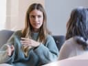 Young woman talking to therapist