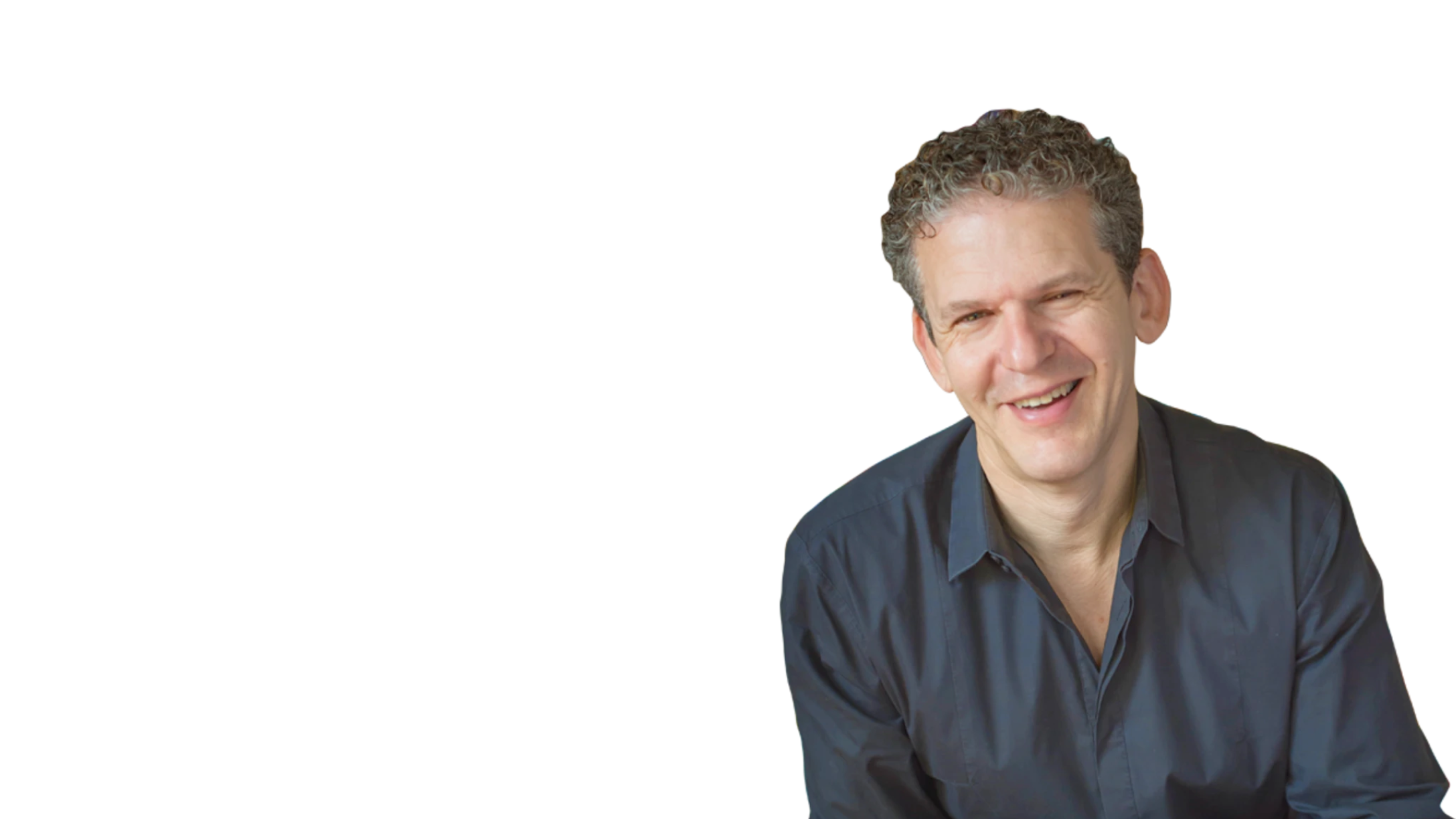 Russ Harris smiling at the camera