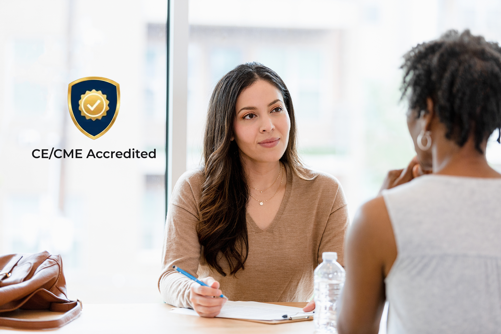 Woman at computer with CE Accreditation badge