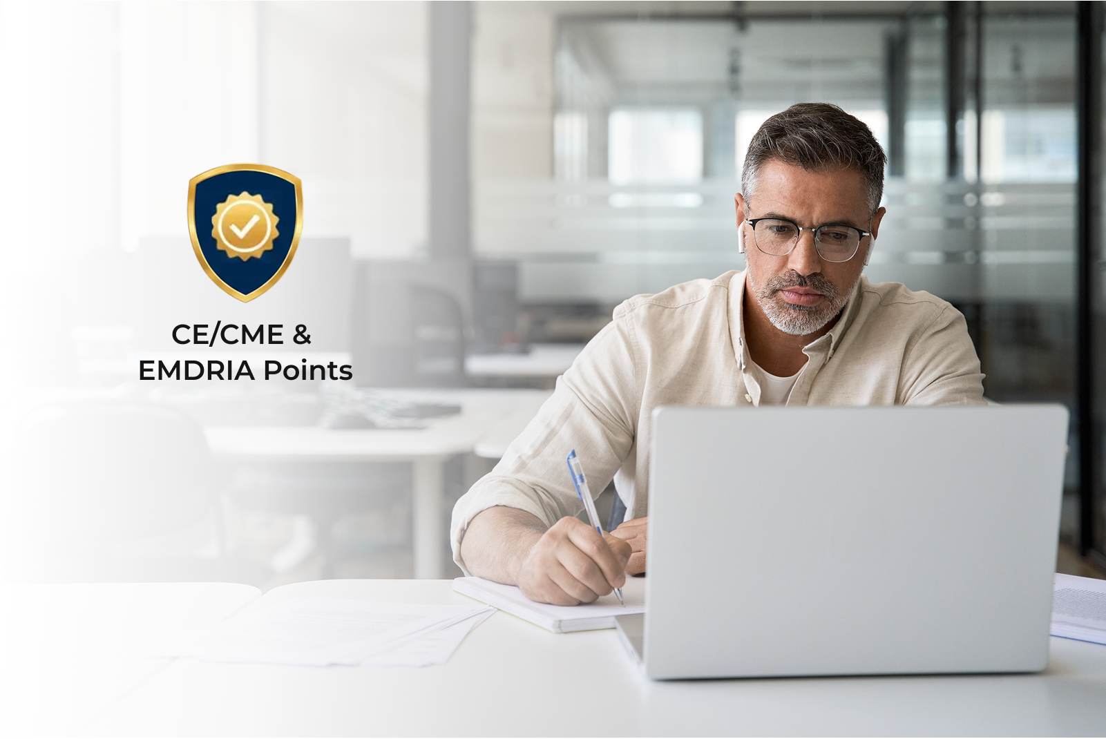 Man at a computer with a CE Badge