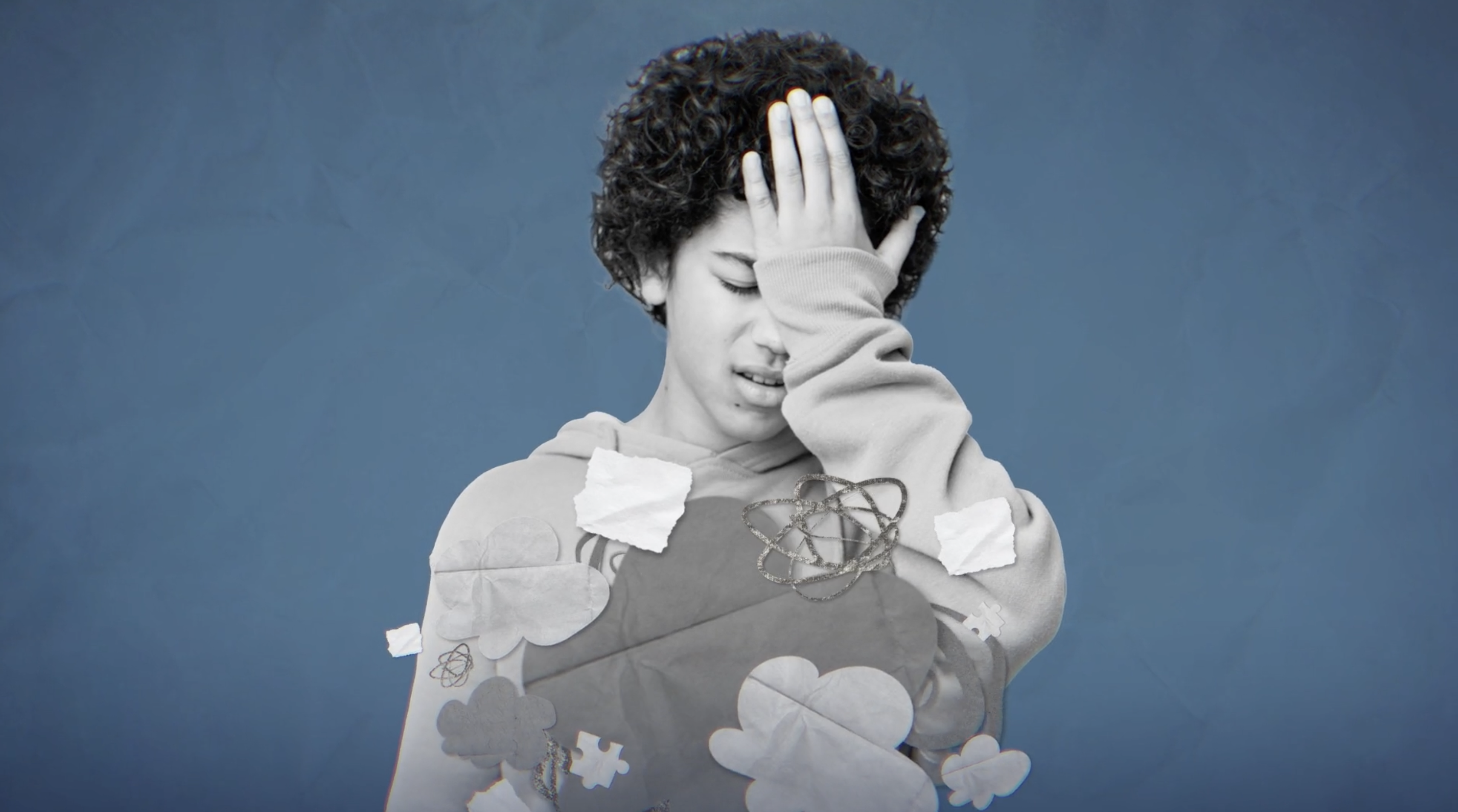 boy with hand on forehead