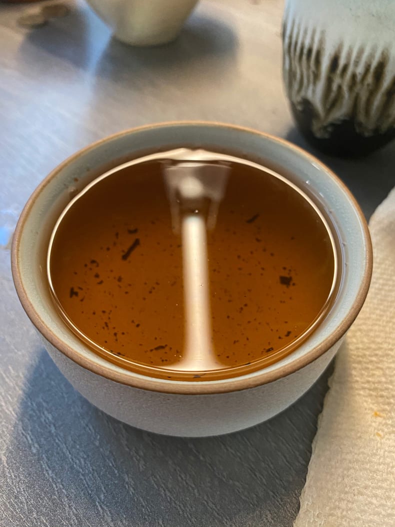 Liquor after 7 steeps, more transparent and lightened to a pale amber