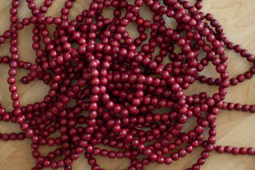 Strings of wooden cranberry beads