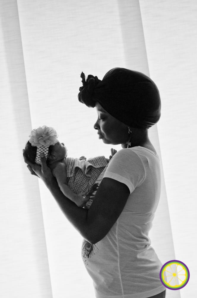 African American mother holding newborn baby