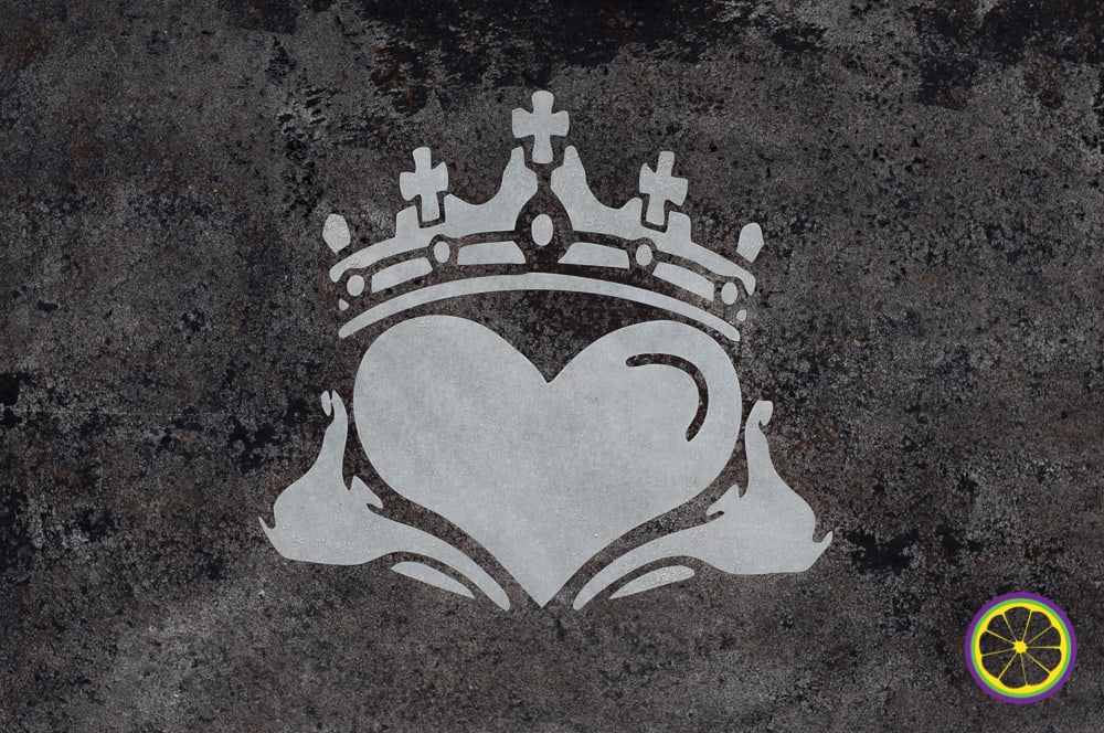 Painted heart with crown on a textured wall near Tower Grove Park