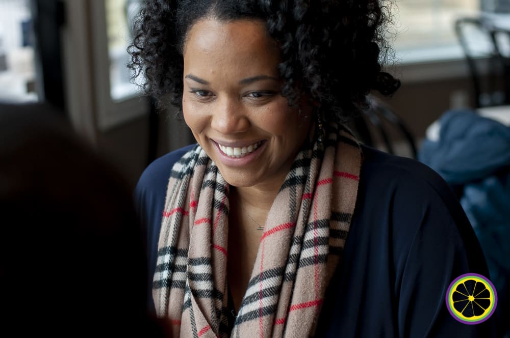 African American woman smiles at her fiancée