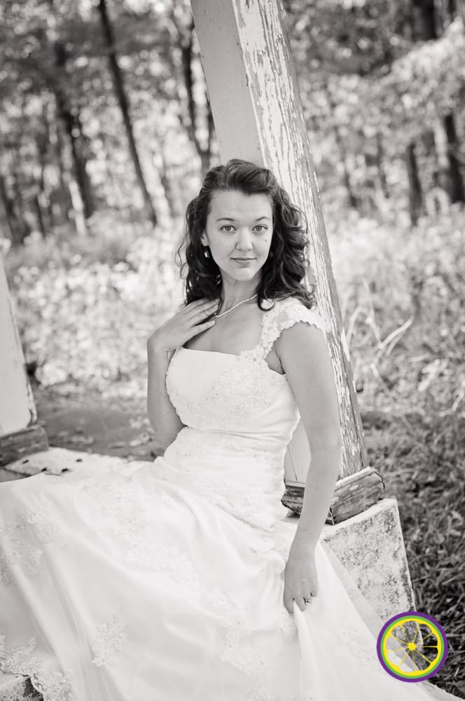 bride sitting with back against white washed wood in west county saint louis