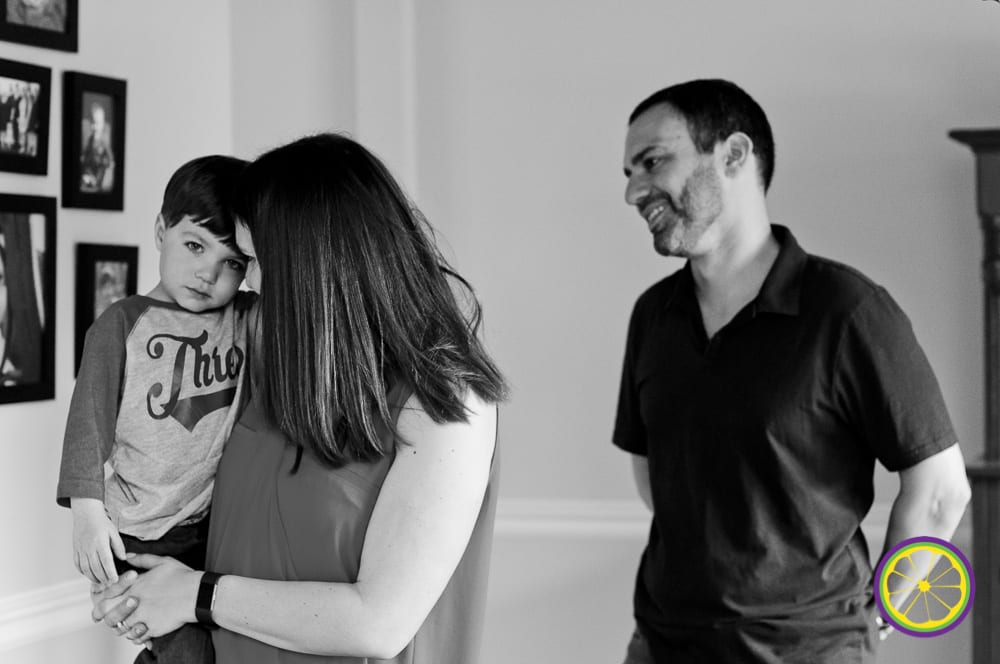 shy preschooler comforted by parents