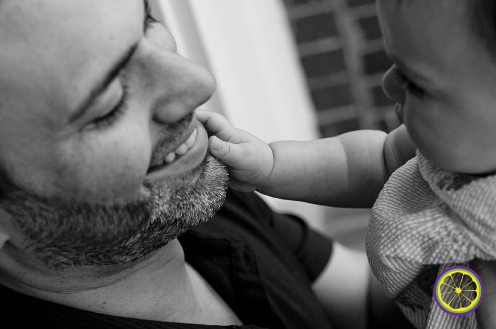 baby pulls on dads whiskers