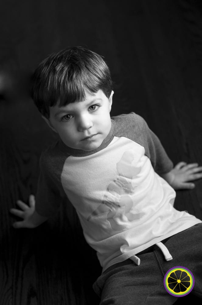 STL photograph of boy on the floor