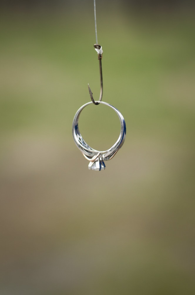 engagement ring hanging on fishing hook