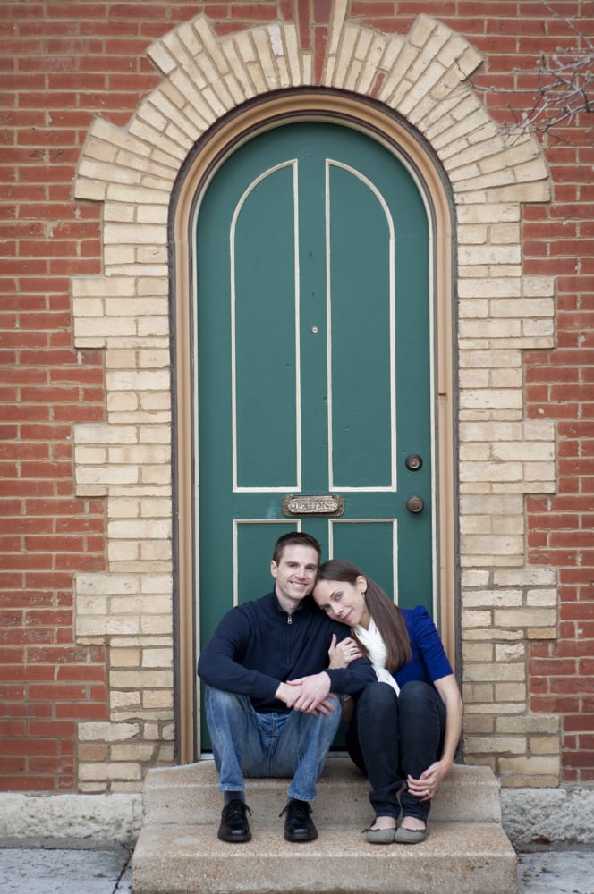 Couple in Lafayette Square in St. Louis MO sitting in arched door