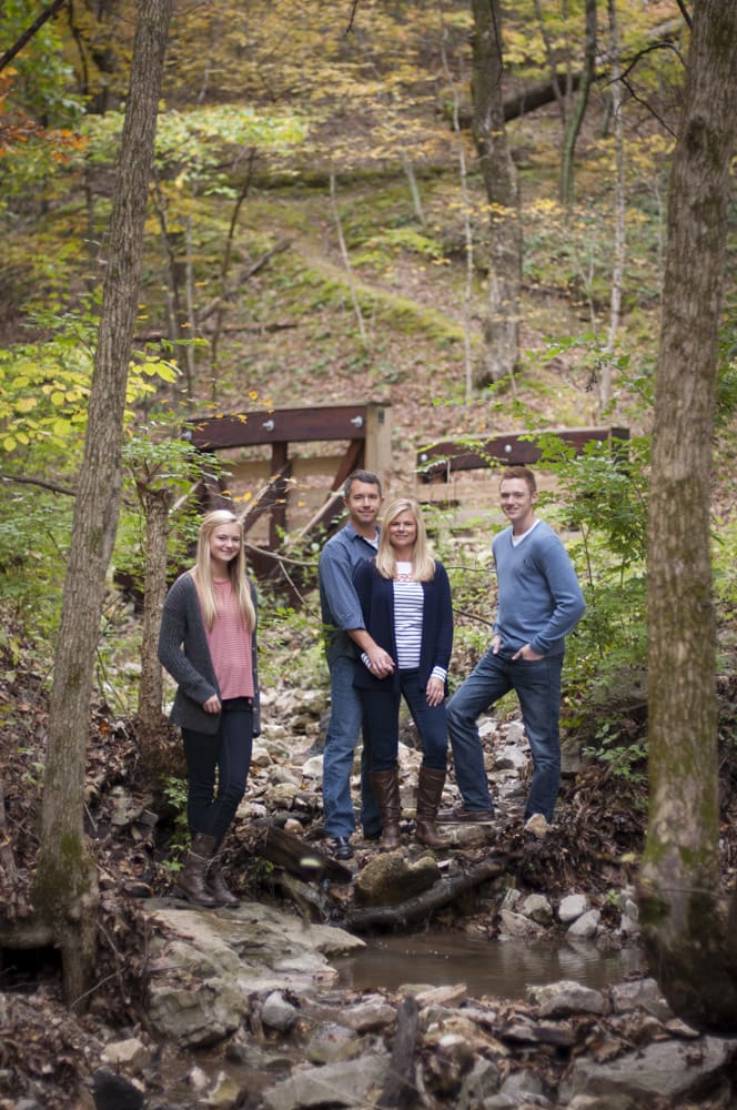 photograph of family with two teenagers in nature