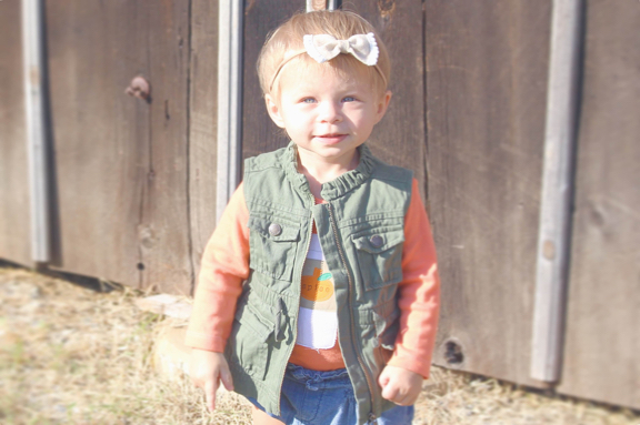 Rose in freen jacket looking at camera