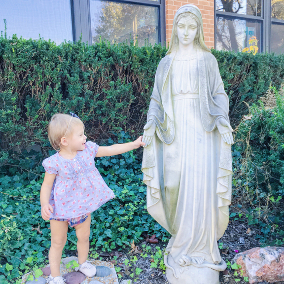 Rose holding hands with Mary statue