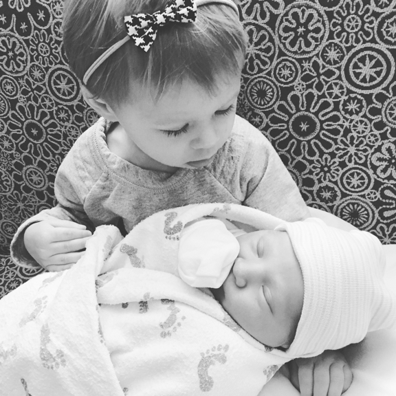 Rose holding her new baby cousin