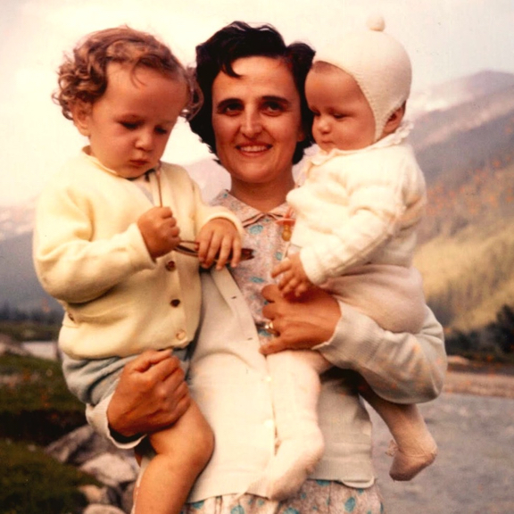 A photo of St. Gianna holding two of her children