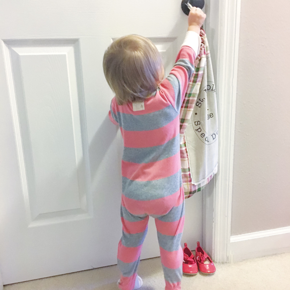 Rose taking her St. Nick's bag off her door handle