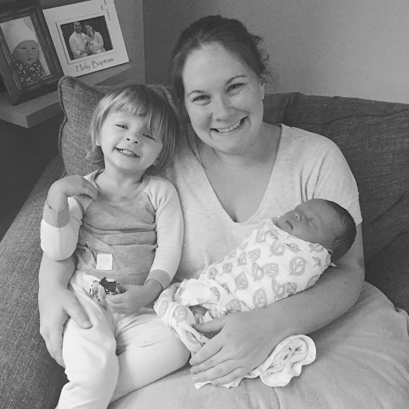 Becky in a chair with Kolbe and Rose