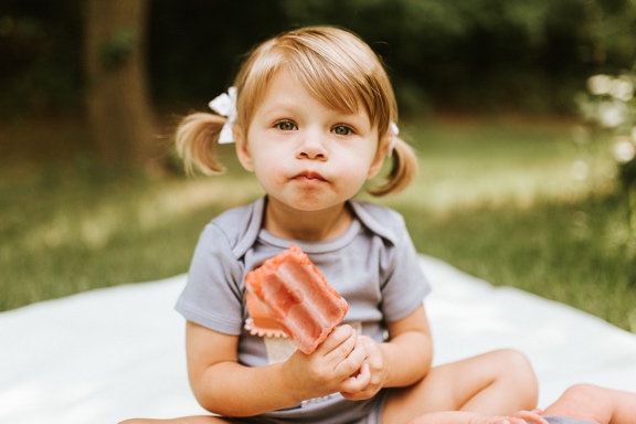 Rose solemnly holding a popsicle