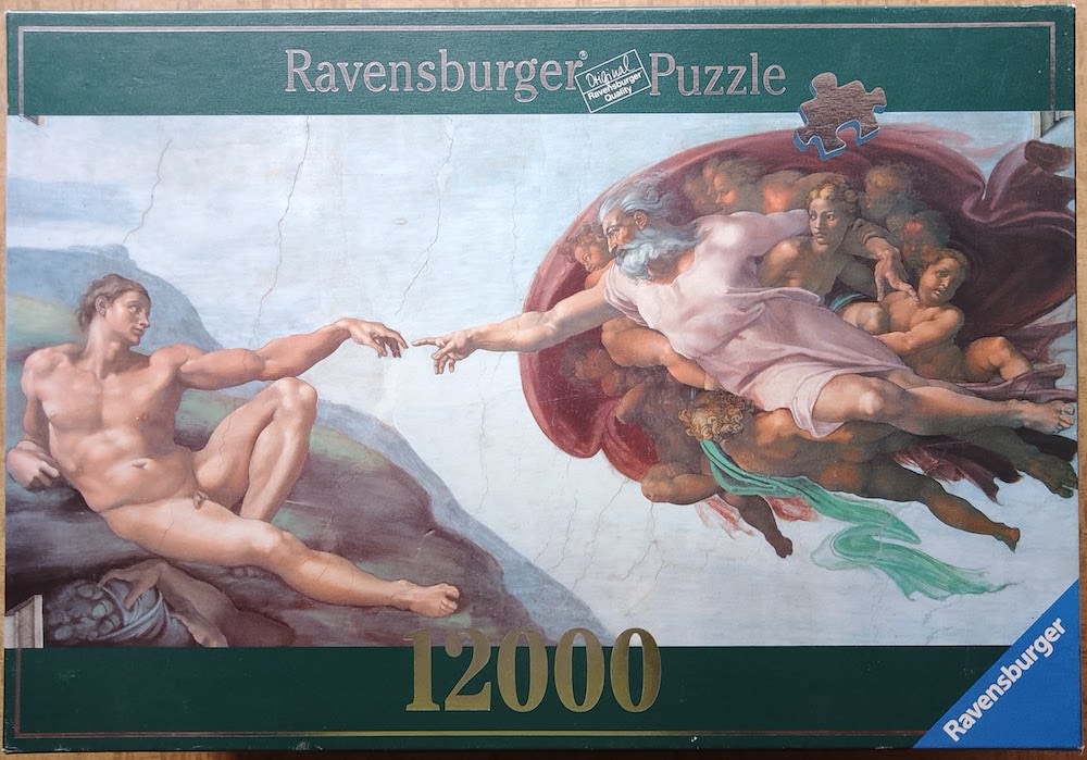 A reproduction of Michelangelo's The Creation of Adam featuring the iconic finger-touching scene.