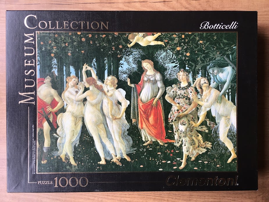 A reproduction of Sandro Botticelli's Primavera painting featuring mythological figures in a lush orange grove.