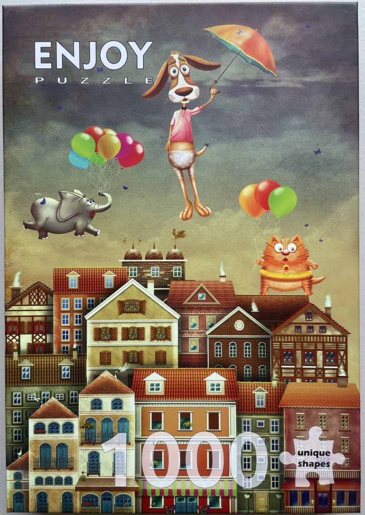 Whimsical illustration of an elephant, a dog with an umbrella, and a cat floating over a European-style town.