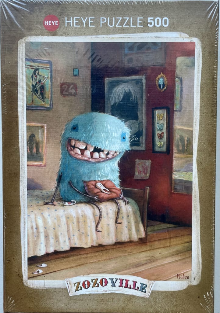 A whimsical blue furry creature with a wide, toothy grin sits on a bed in a dark red room filled with framed art.