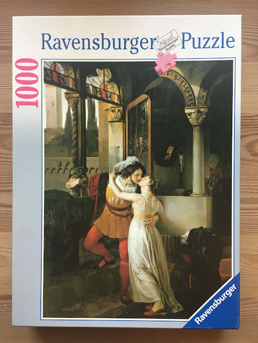 A romantic oil painting depicting a couple embracing and kissing in a classical, shadowed stone archway.
