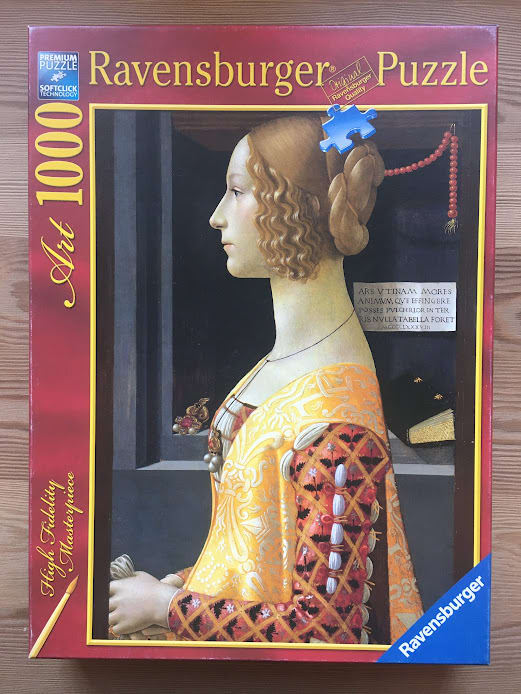Portrait of a young Renaissance woman in profile wearing a patterned yellow and orange dress.