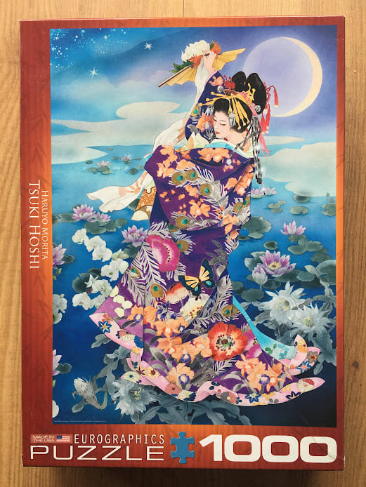 A Japanese woman in a vibrant floral kimono stands in a pond of water lilies under a crescent moon.
