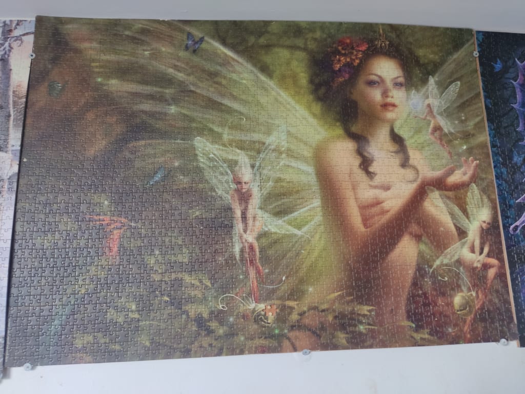 An ethereal painting of a fairy queen holding a tiny winged creature in a forest setting.