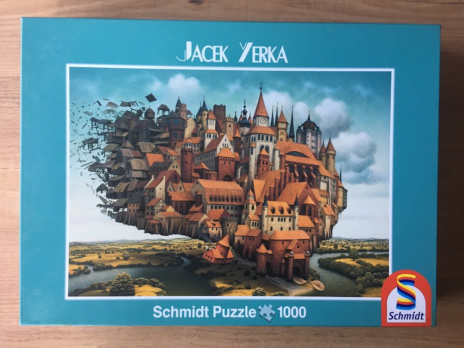 A surreal illustration of a sprawling medieval city floating above a river landscape, where the left side is disintegrating.