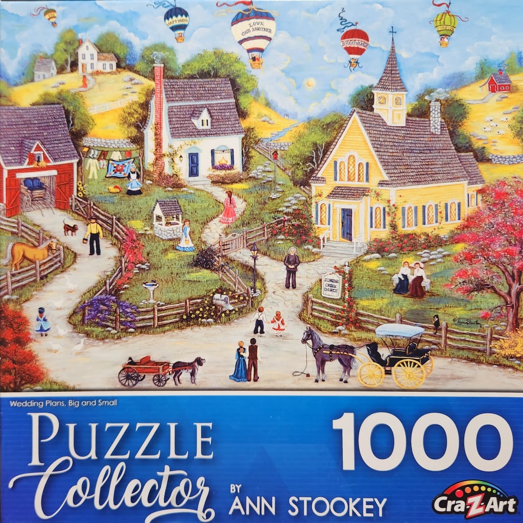 A folk art illustration of a rural village with a yellow church, cottages, horse-drawn carriages, and hot air balloons.