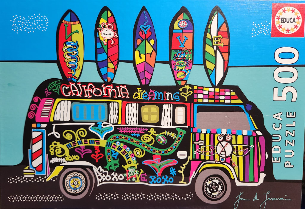 A whimsical illustration of a colorful retro van carrying five surfboards against a bright blue sky.