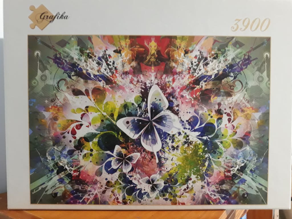 A digital illustration of several butterflies amidst a vibrant, abstract explosion of color and swirling floral patterns.